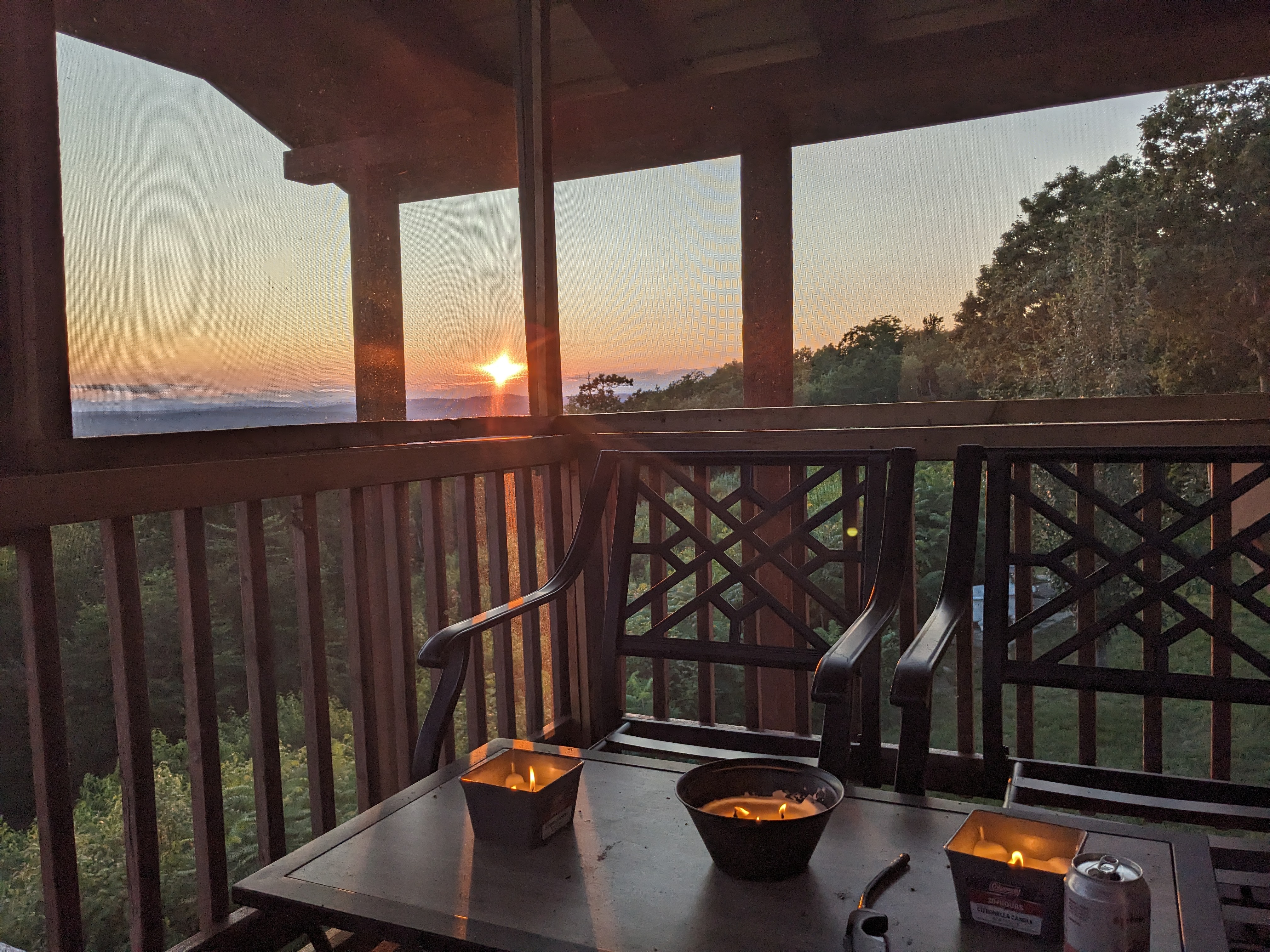 Candles and a quiet summer evening on the screened porch as the sun sets